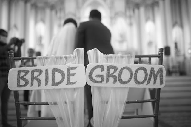Chairs with the words bride and groom on them